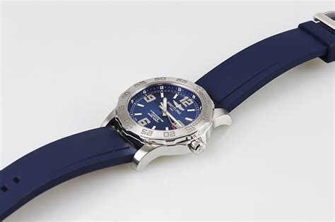 The stainless steel copy watches have blue rubber straps.